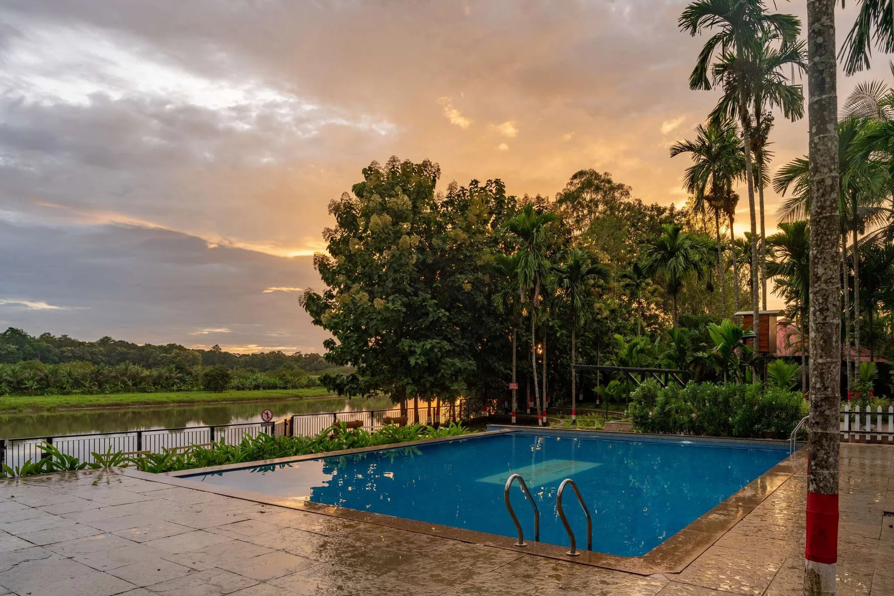 Swimming pool and riverside setting at a Dandeli stay
